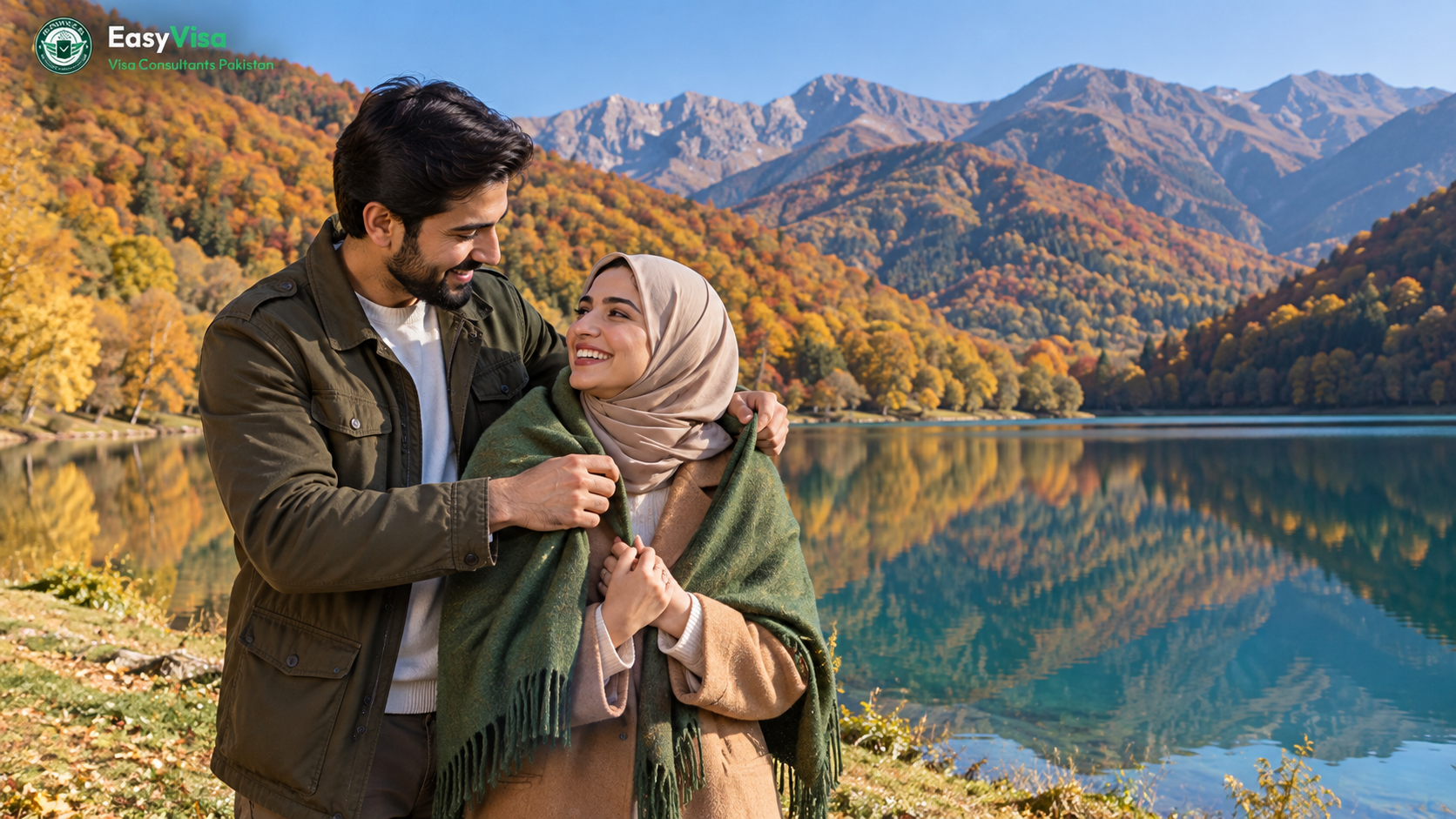Pakistani honeymoon couple at Nohur Lake in Gabala, Azerbaijan, with golden autumn trees and Caucasus mountains