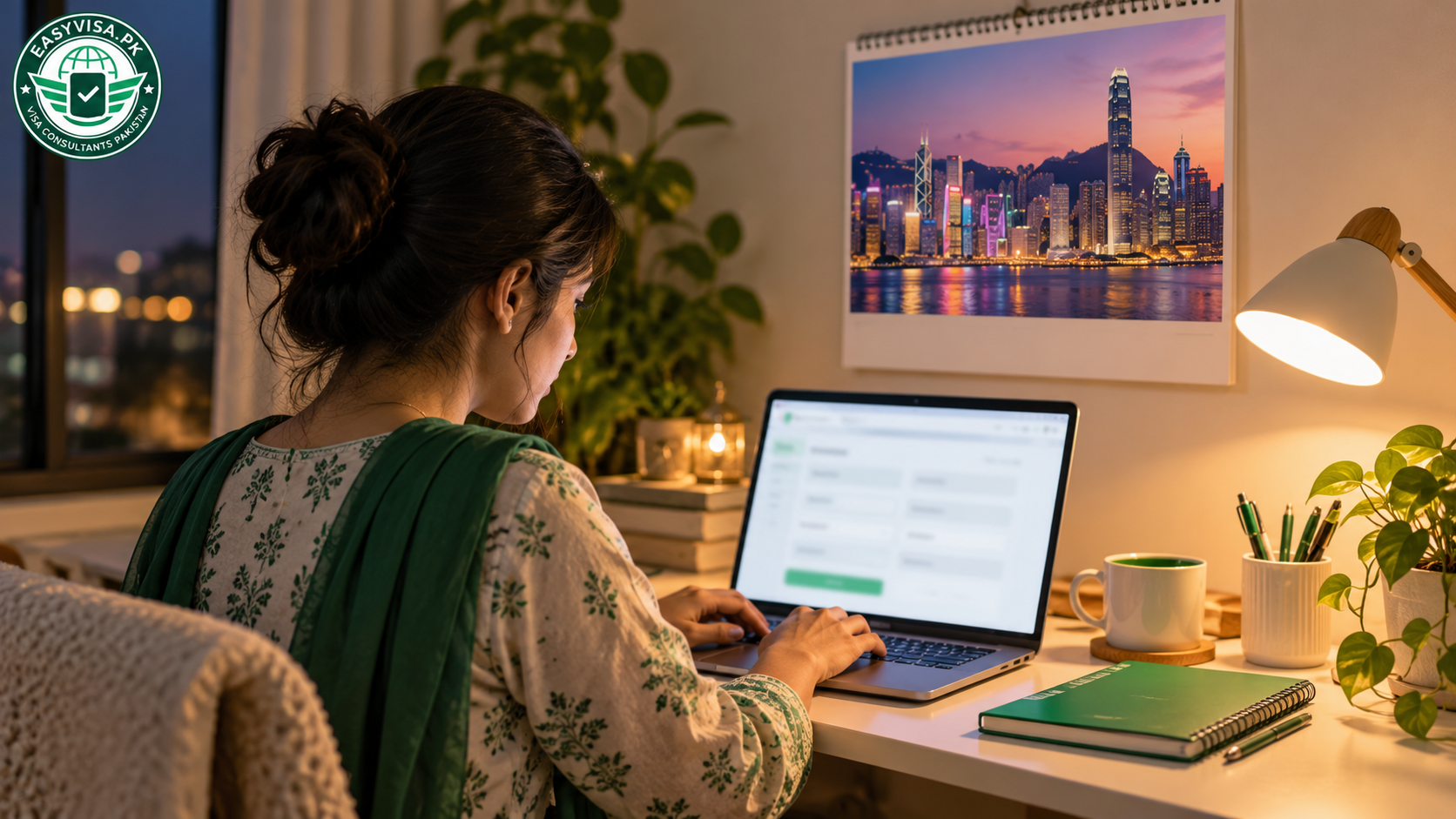 Pakistani applicant completing an online Hong Kong visa application on a laptop at home