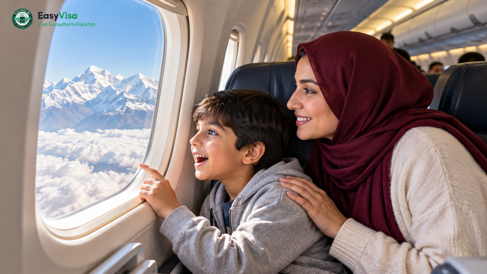 Pakistani mother and her young son at an aircraft window looking at the snow-covered Himalaya on the approach to Kathmandu
