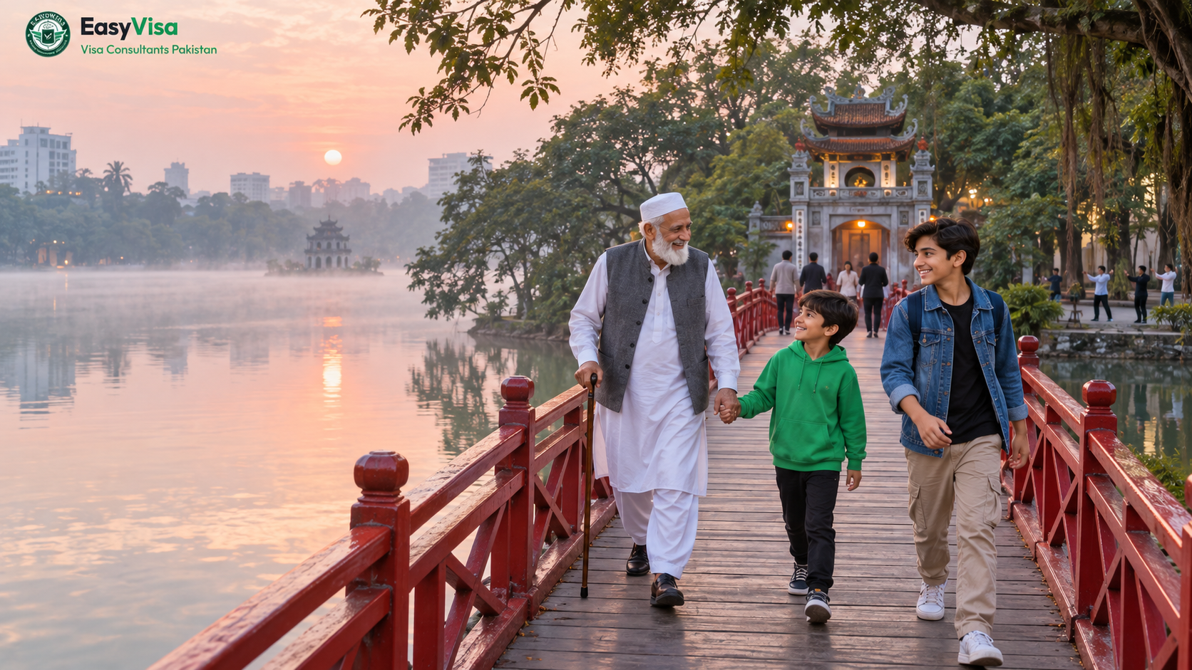 Pakistan to Vietnam trip - Pakistani grandfather and two grandsons crossing the red Huc Bridge on Hoan Kiem Lake in Hanoi at dawn