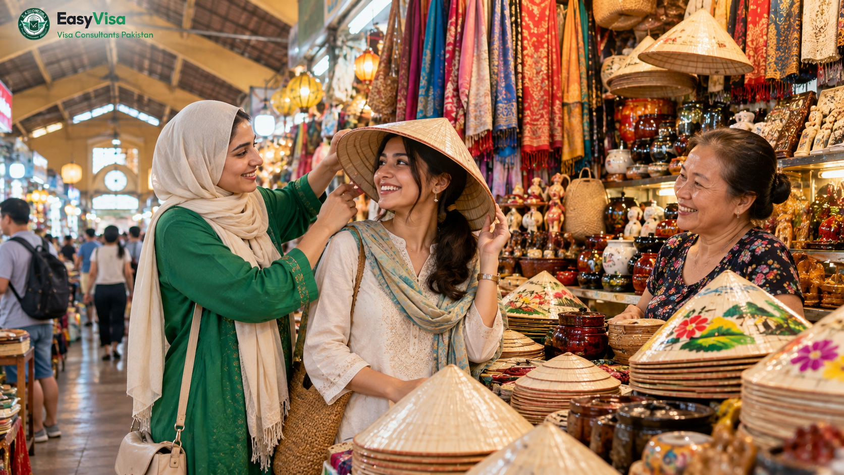 Two Pakistani sisters in their twenties choosing conical hats at a stall inside Ben Thanh Market, Ho Chi Minh City