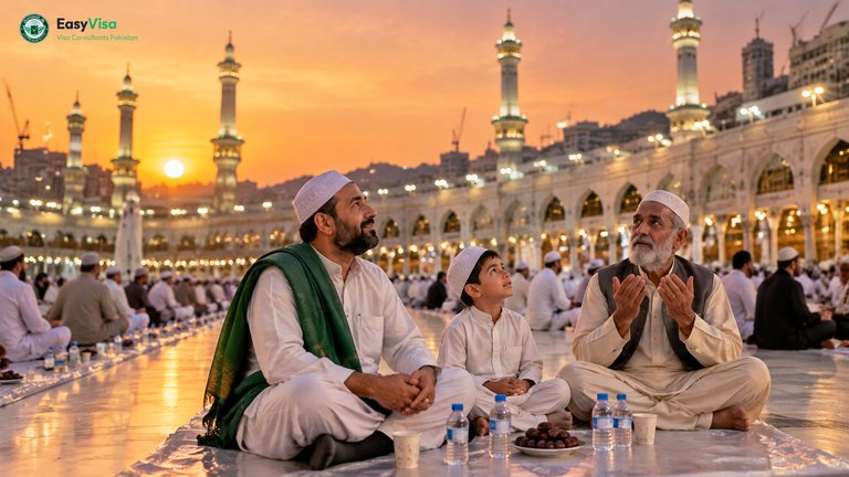 Ramadan Umrah from Pakistan - Pakistani father, son and uncle breaking their fast with dates and Zamzam on the marble courtyard outside Masjid al-Haram at sunset