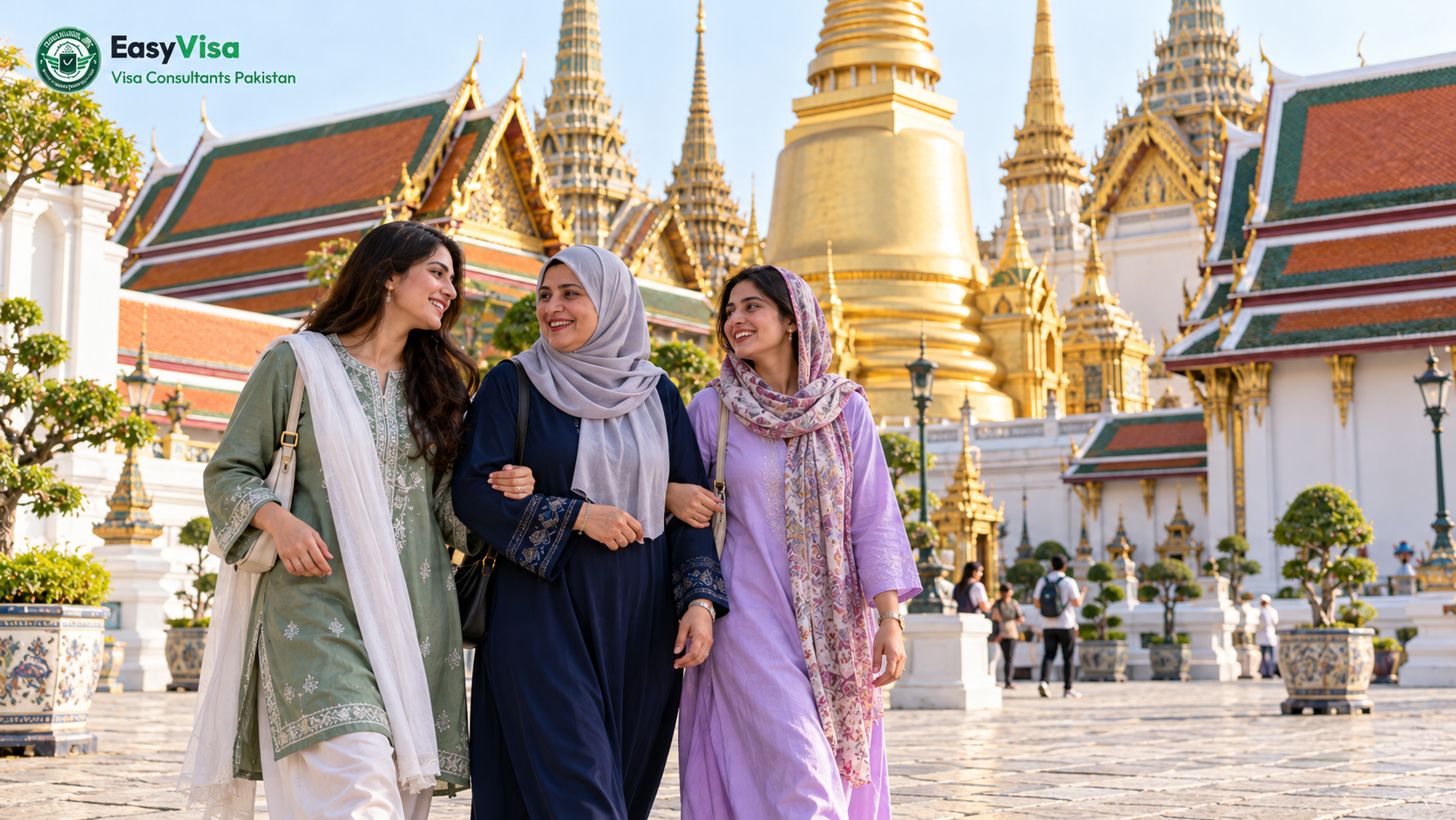 Pakistani mother and her two adult daughters in modest dress walking through the Grand Palace courtyard in Bangkok on day two of their Thailand itinerary