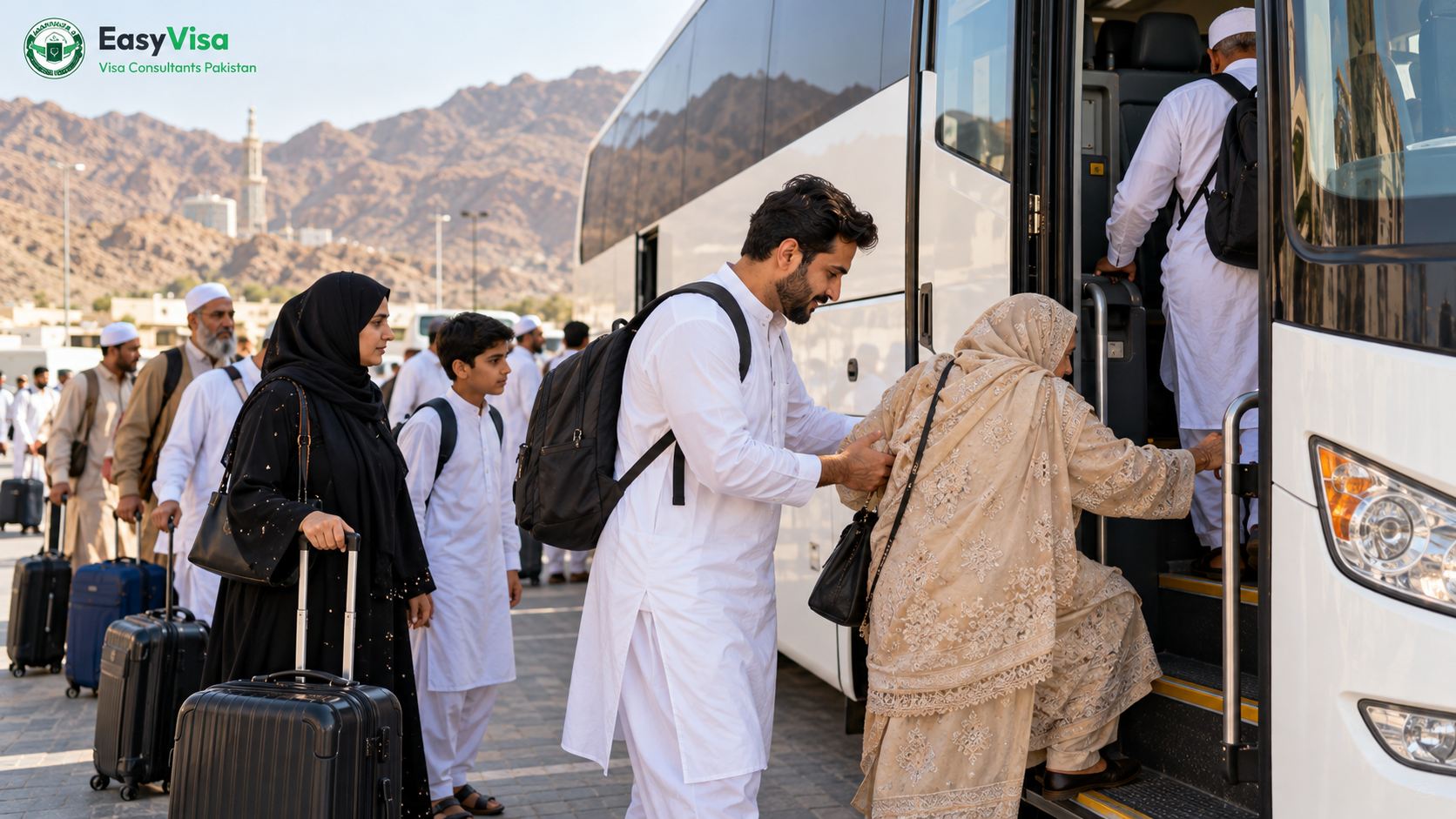 Pakistani pilgrims boarding a shared coach for the Makkah to Madinah journey at daylight